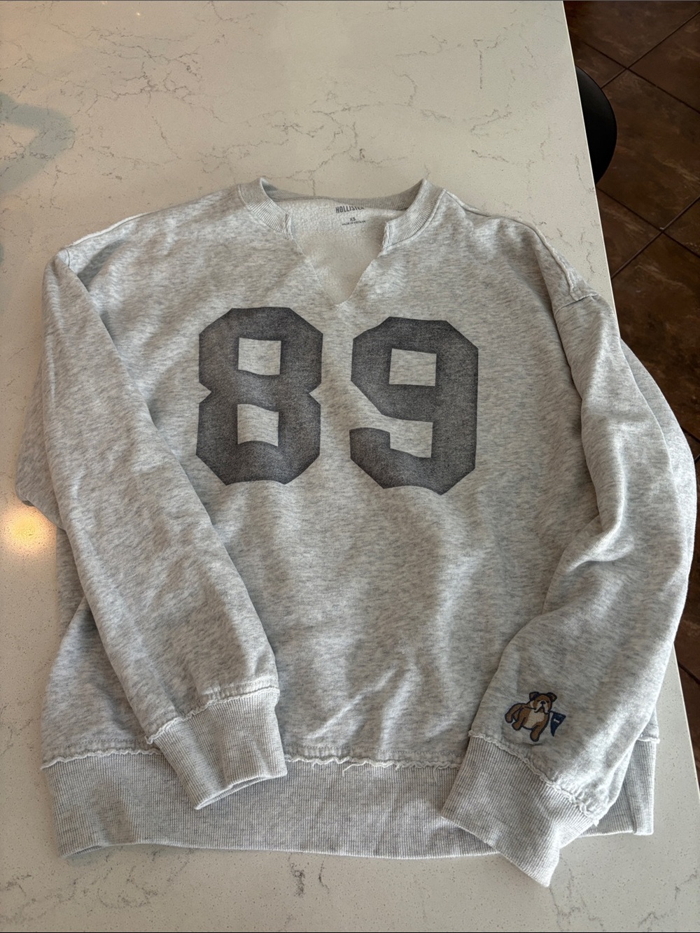 Hollister Light Gray V-Neck Sweater with Dark Gray '89 Graphic